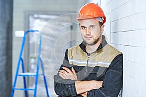 construction worker portrait indoors. Concept of building or service employee photo