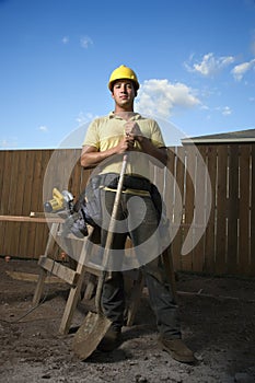 Construction Worker Standing with Shovel