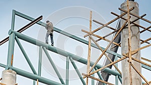 Construction worker standing on steel structure