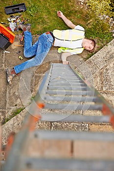 Construction Worker Suffering Injury After Fall From Ladder photo