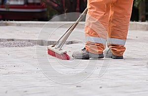 Construction worker sweeping