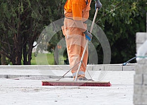 Construction worker sweeping
