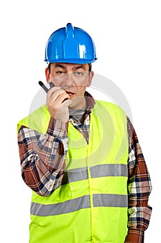 Construction worker talking with a walkie talkie