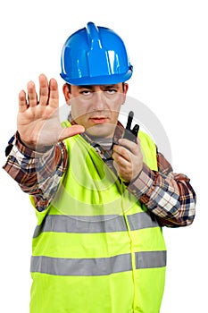 Construction worker talking with a walkie talkie and orders to s