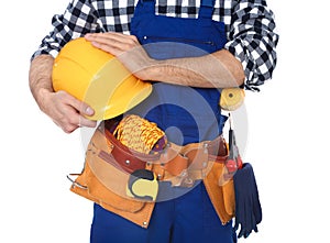 Construction worker with tool belt on white background