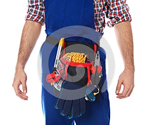 Construction worker with tool belt on white background,