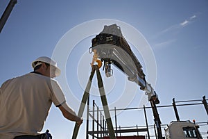 Construction Worker Unloading Material From Truck