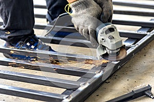 Construction worker use hand grinder machine .