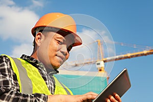 Construction worker using digital tablet