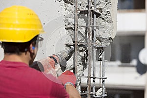 Construction worker using a drilling power tool