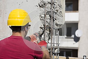 Construction worker using a drilling power tool