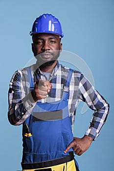 Construction worker using index finger to point