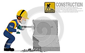 A construction worker is using jack hammer for demolishing the concrete barrier