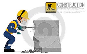 A construction worker is using jack hammer for demolishing the concrete barrier photo