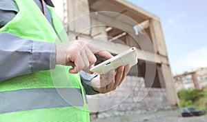 Construction worker using tablet in outdoor