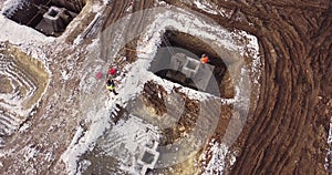 Construction Worker Using Theodolite Surveying Optical Instrument for Measuring Angles in Horizontal and Vertical Planes