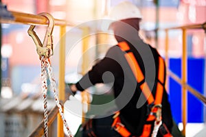 Construction worker wearing safety harness and safety line