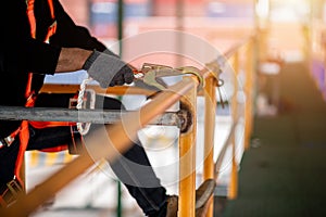 Construction worker wearing safety harness and safety line