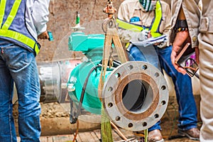 Construction worker welding underground valve gas