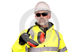 Construction worker in white hat,  yellow hi-viz coat and dark tinted safety glasses on white background gives foam-filled