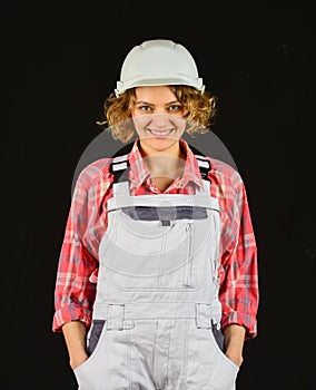 Construction worker. Woman builder in hardhat. Girl engineer or architect. Home renovation. Lady at construction site