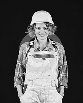 Construction worker. Woman builder in hardhat. Girl engineer or architect. Home renovation. Lady at construction site