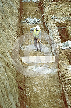 Construction worker working on building foundation