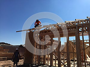 Construction worker working on the framing process for a new a house