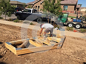Construction worker working on the framing process for a new a house