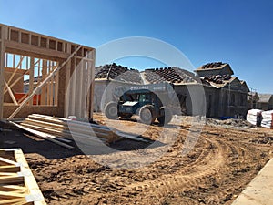Construction worker working on the framing process for a new a house.