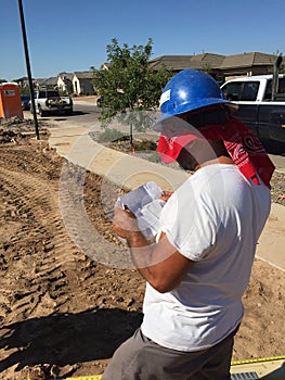 Construction worker working on the framing process for a new a house.