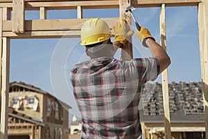 Construction Worker Working On Timber Frame