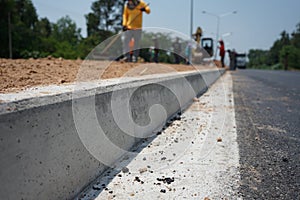 Construction workers are blurred. Outdoor area