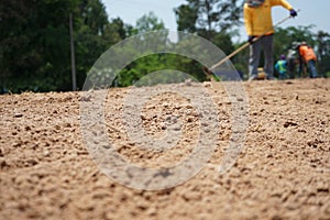 Construction workers are blurred. Outdoor area