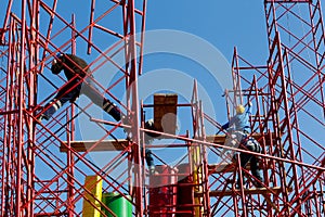 Construction workers building a new structure in city