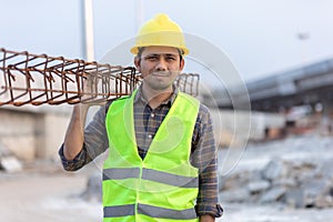 Construction workers carrying metal