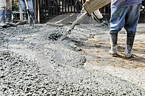 Construction Workers Cementing Road