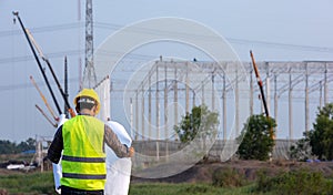 Construction workers check drawings plan blueprint