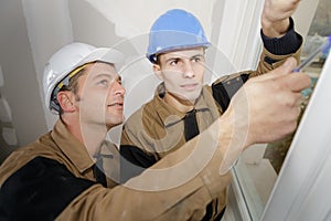 construction workers cleaning joints photo