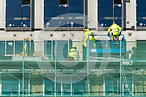 Construction workers collaborating in the installation of cement