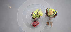 The construction workers collaborating on a project at a job site. AI generated image