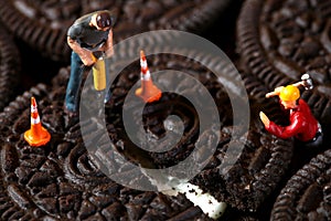 Construction Workers in Conceptual Imagery With Cookies