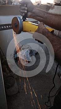 Construction workers cutting steel for fabrication work at a under construction building