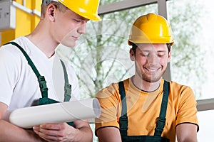 Construction workers discussing project