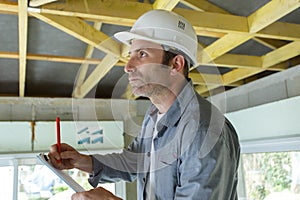 construction workers doing roof job