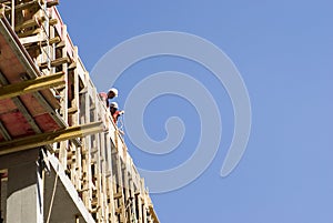 Construction Workers at Edge of Building