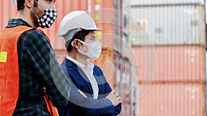 Construction workers or engineer wear safety helmet And the mask in the factory Or container. Prevent accidents at work or dust,