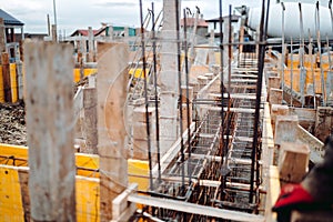 Construction workers fabricating steel reinforcement bar at construction site
