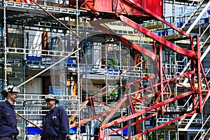 Construction workers and giant building site