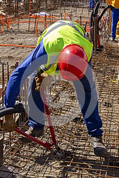 Construction workers during installation of steel gratings for the foundation of a building. Sao Paulo, Brazil